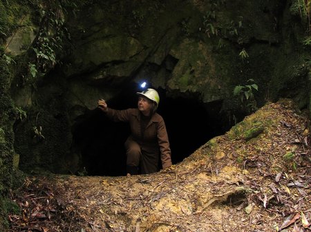 Artist Chris T Wilson at the entrance of an old mine near Zeehan, Tasmania (cred. The Artist)