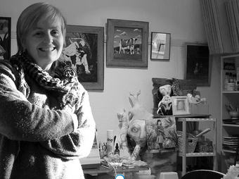 Black and white photo of Grace Garton in her painting studio.
