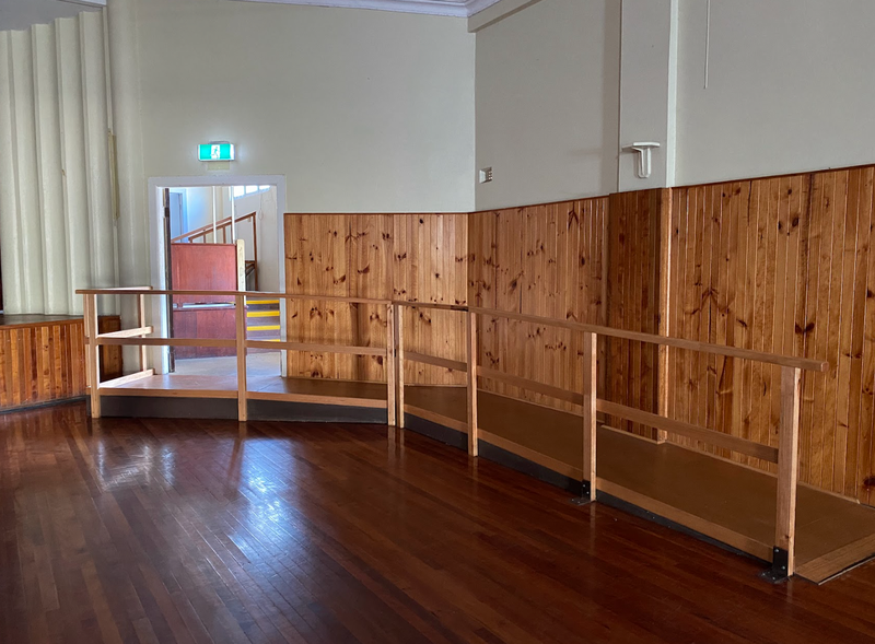 A photo of the internal ramp found inside the side entrance of Queenstown Memorial Hall.