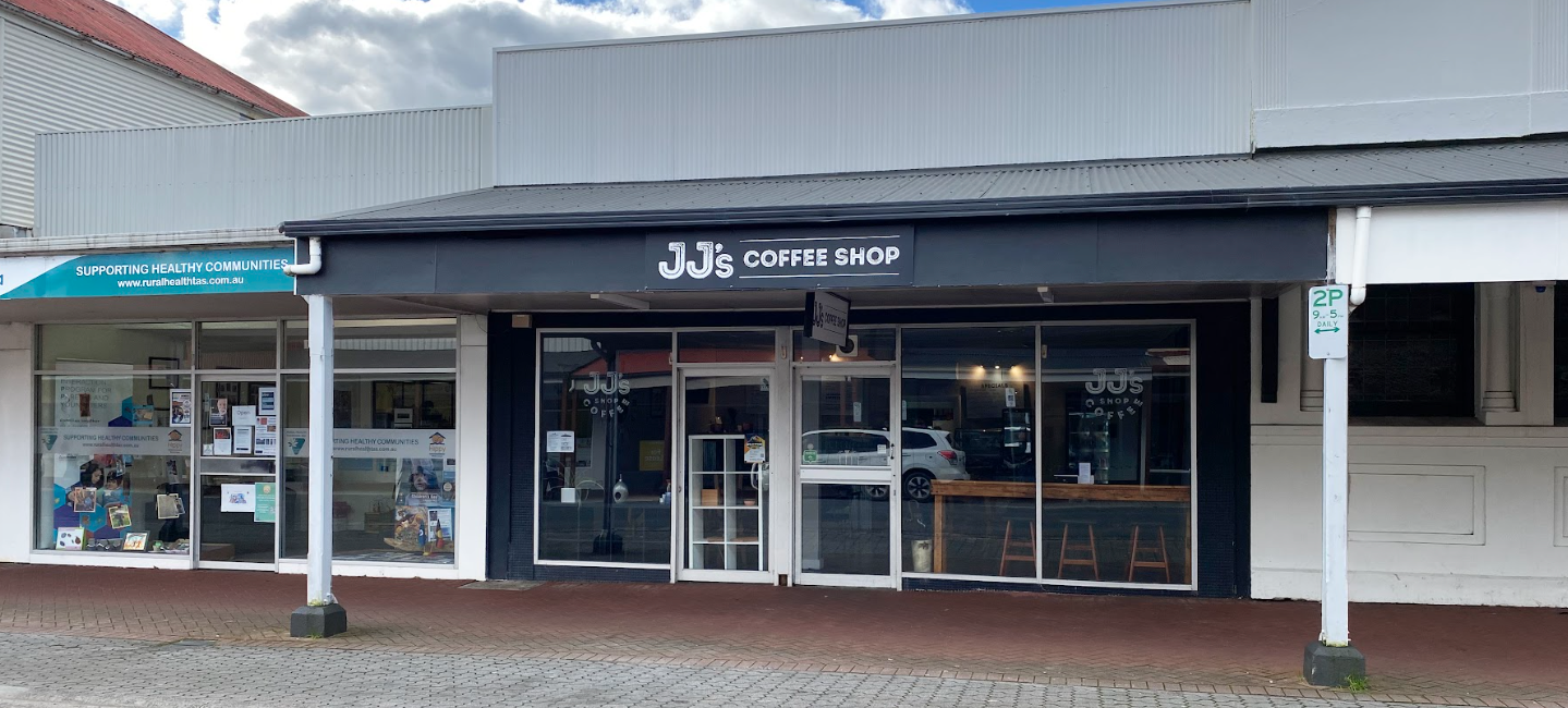 A photo taken form Orr Street, Queenstown, of the front windows and facade of JJ's Coffee Shop.