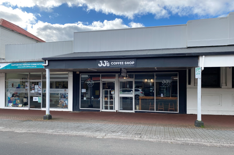 A photo taken form Orr Street, Queenstown, of the front windows and facade of JJ&#x27;s Coffee Shop.