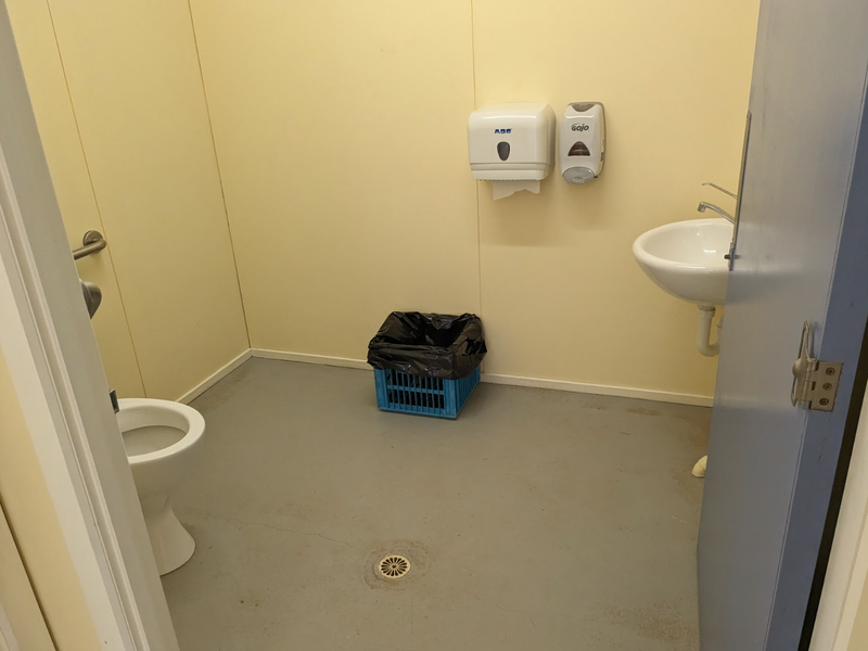 A photo taken from the doorway of the inside of the accessible bathroom at Queenstown Football Ground..