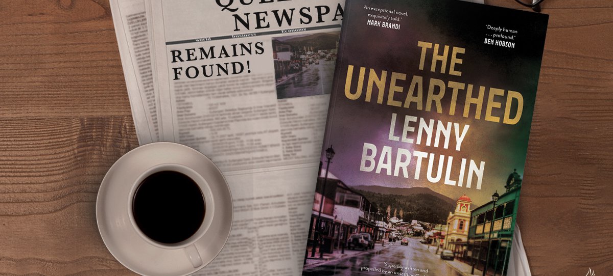 A photo of 'The Unearthed' novel by Lenny Bartulin laying on top off a newspaper, beside a cup of black coffee.